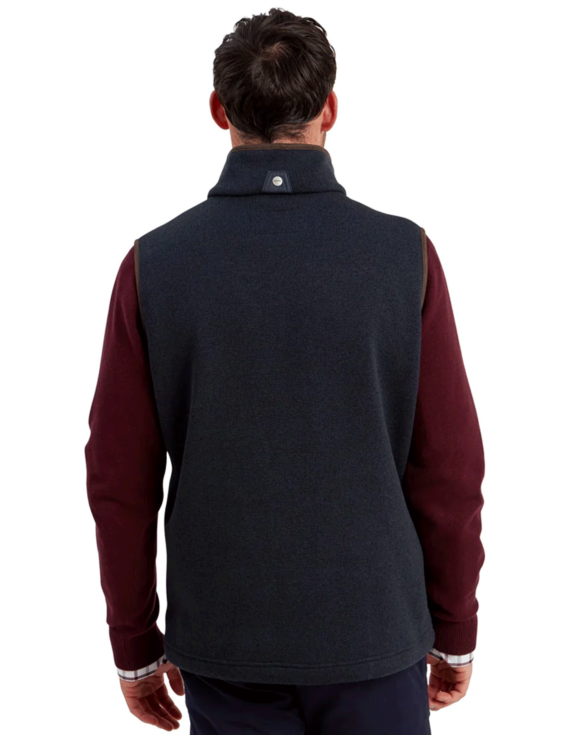 Back view of a man wearing a burgundy jumper with a navy Schöffel Oakham Hybrid Gilet
