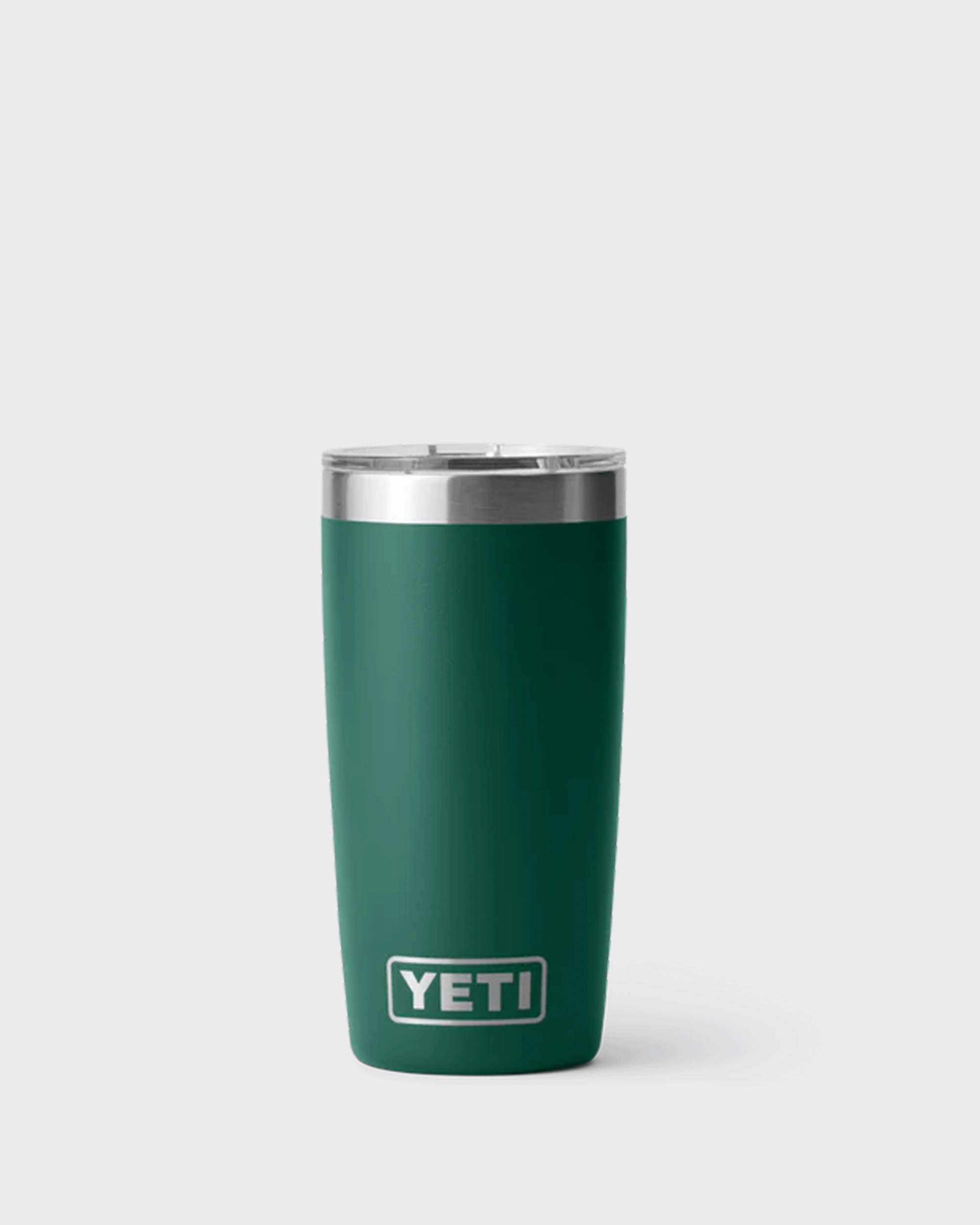 Rich green YETI vacuum-insulated stainless steel tumbler with clear lid and tapered design. Colour is called Black Forest Green.