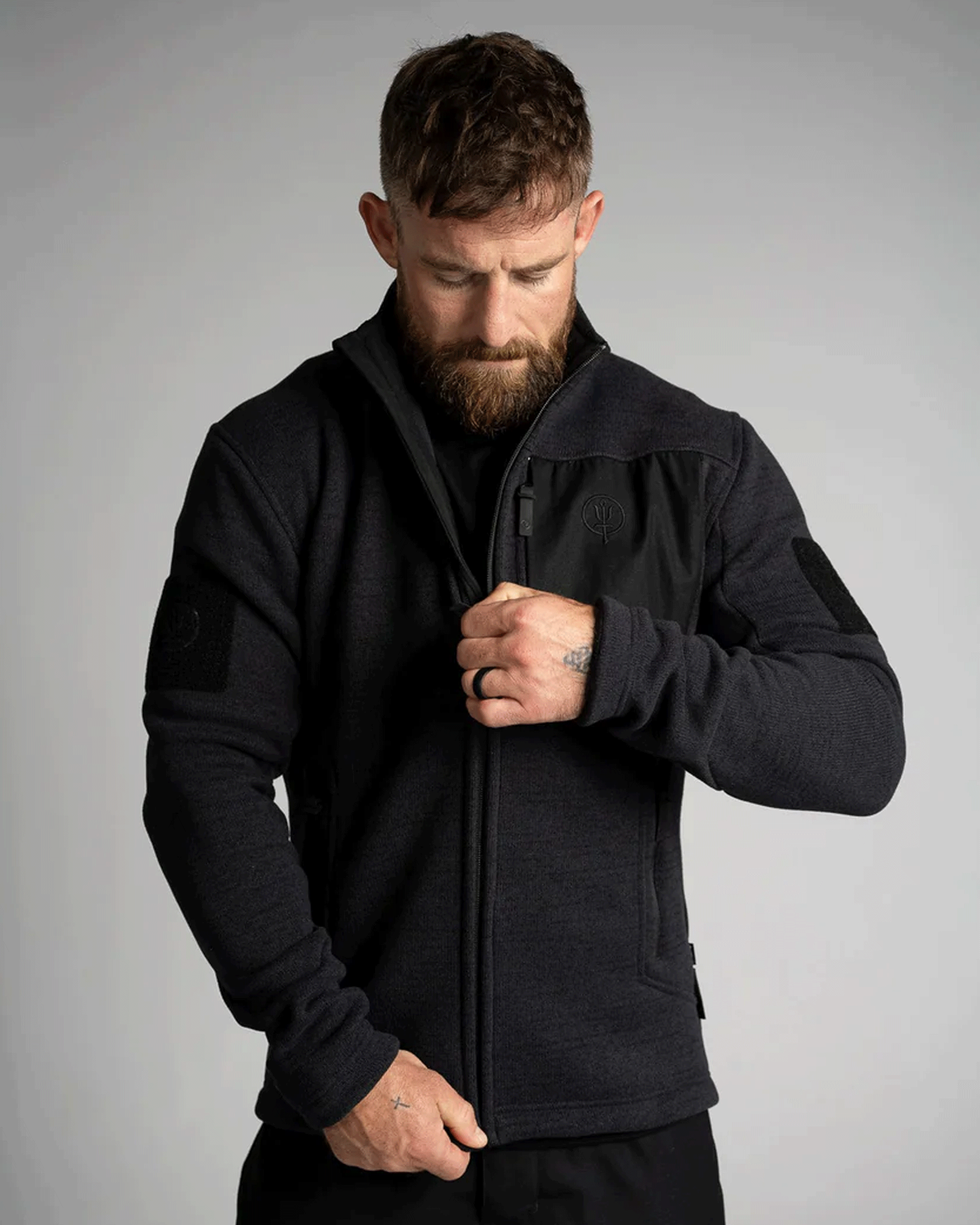 A Black Thrudark Morland Fleece jacket worn by a bearded man