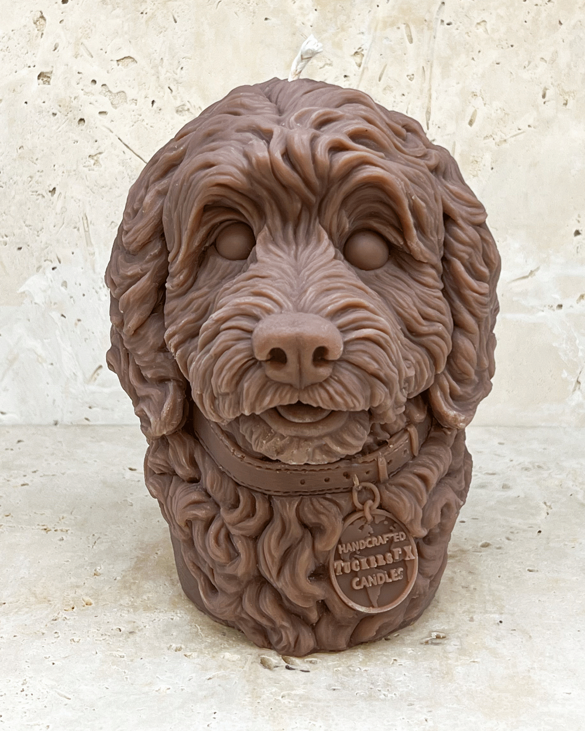 A brown Cockerpoo dog head moulded candle 